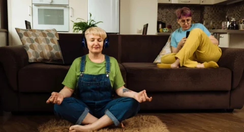 mature-caucasian-woman-meditating-through-headphon-2023-11-27-05-19-54-utc_11zon