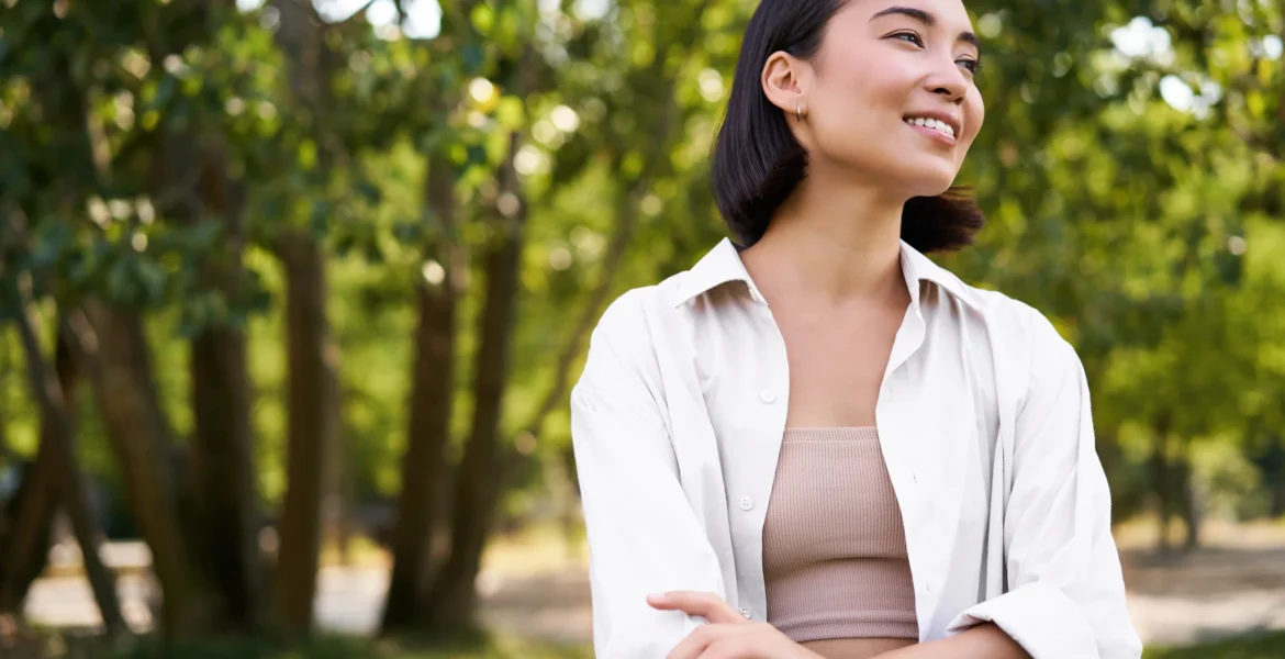 image-korean-girl-walking-park-smiling-while-having-mindful-walk-woods