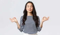 lifestyle-people-emotions-casual-concept-relaxed-patient-smiling-young-asian-woman-with-closed-eyes-meditating-calm-down-breathing-exercises-with-hands-zen-gesture_11zon