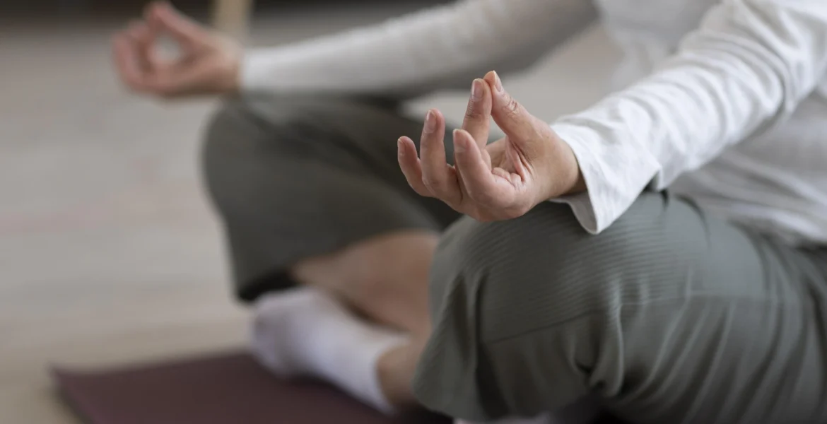 close-up-person-meditating-home