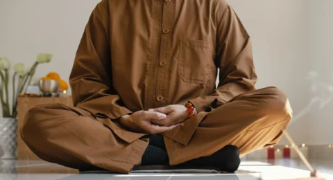 front-view-man-meditating-with-incense (1) (1)