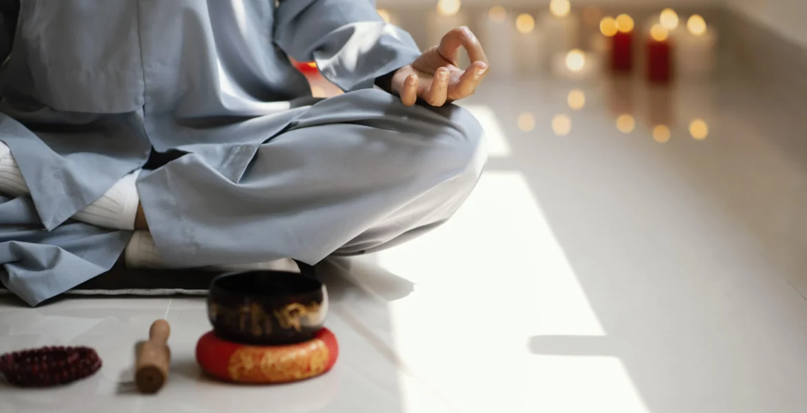 front-view-woman-meditating-with-incense-candles