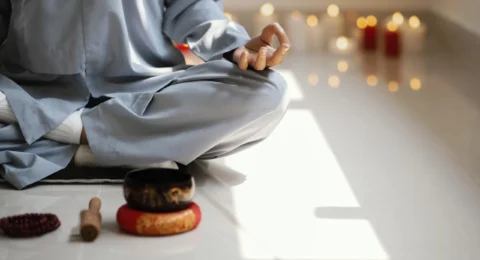 front-view-woman-meditating-with-incense-candles