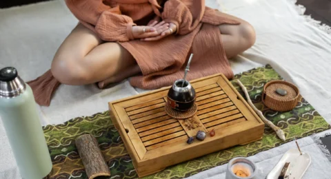 high-angle-woman-meditating-outdoors_11zon