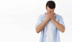 portrait-depressed-tired-young-caucasian-man-hold-hands-face-sighing-feel-regret-grief-standing-distressed-feeling-mental-breakdown-work-burnout-white-wall_11zon